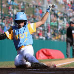 west player sliding into home