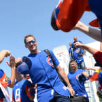 Cubs players walking off airplane