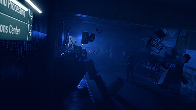 Jesse walking down a purple lighted corridor with recycling bins, table floating around her.