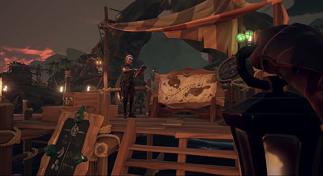 A man stands in front of a map at the Merchant Alliance in Sea of Thieves