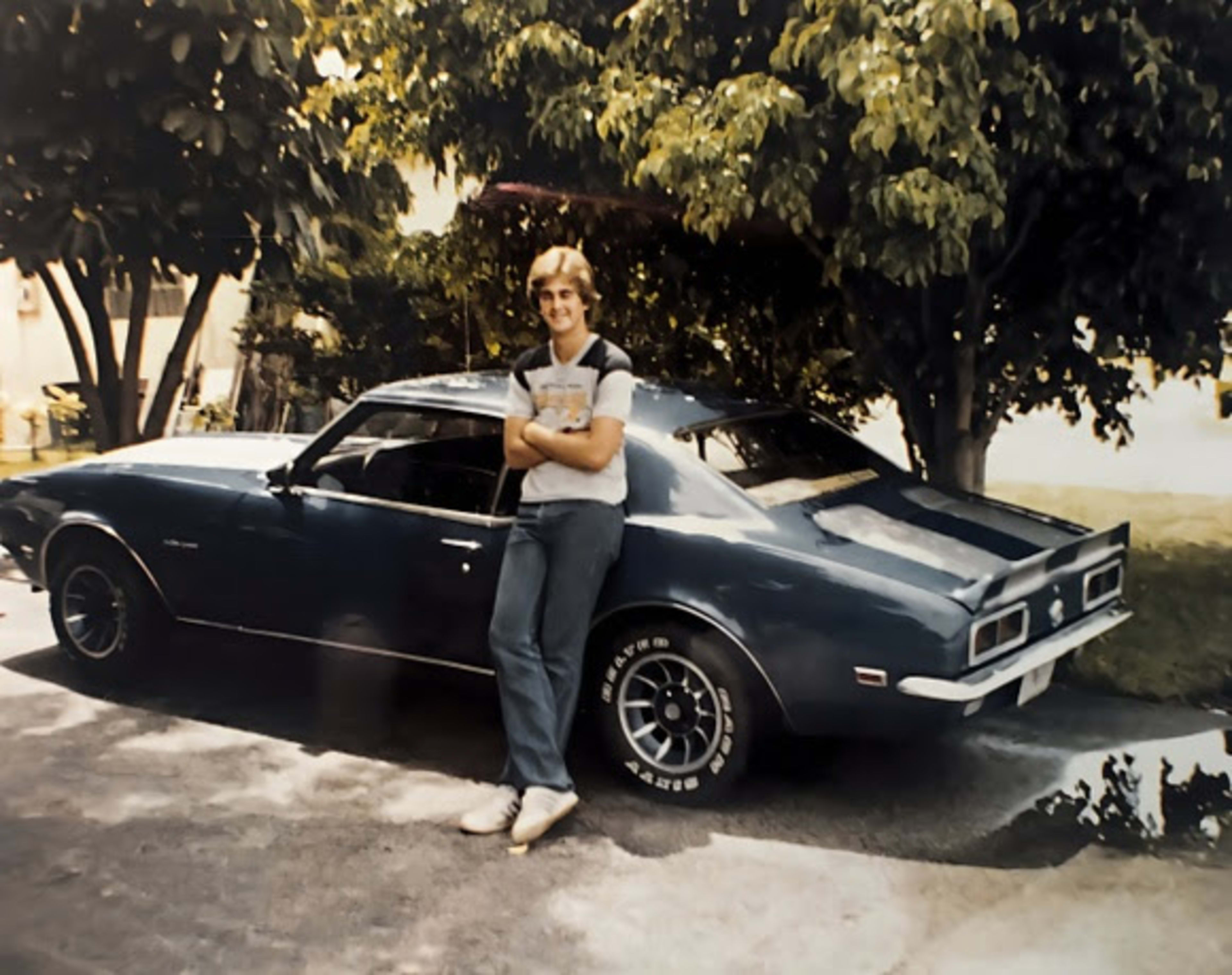 A teenage Bill leaning on his '68 Camaro, bought at 15 with cash from the newspaper route.
