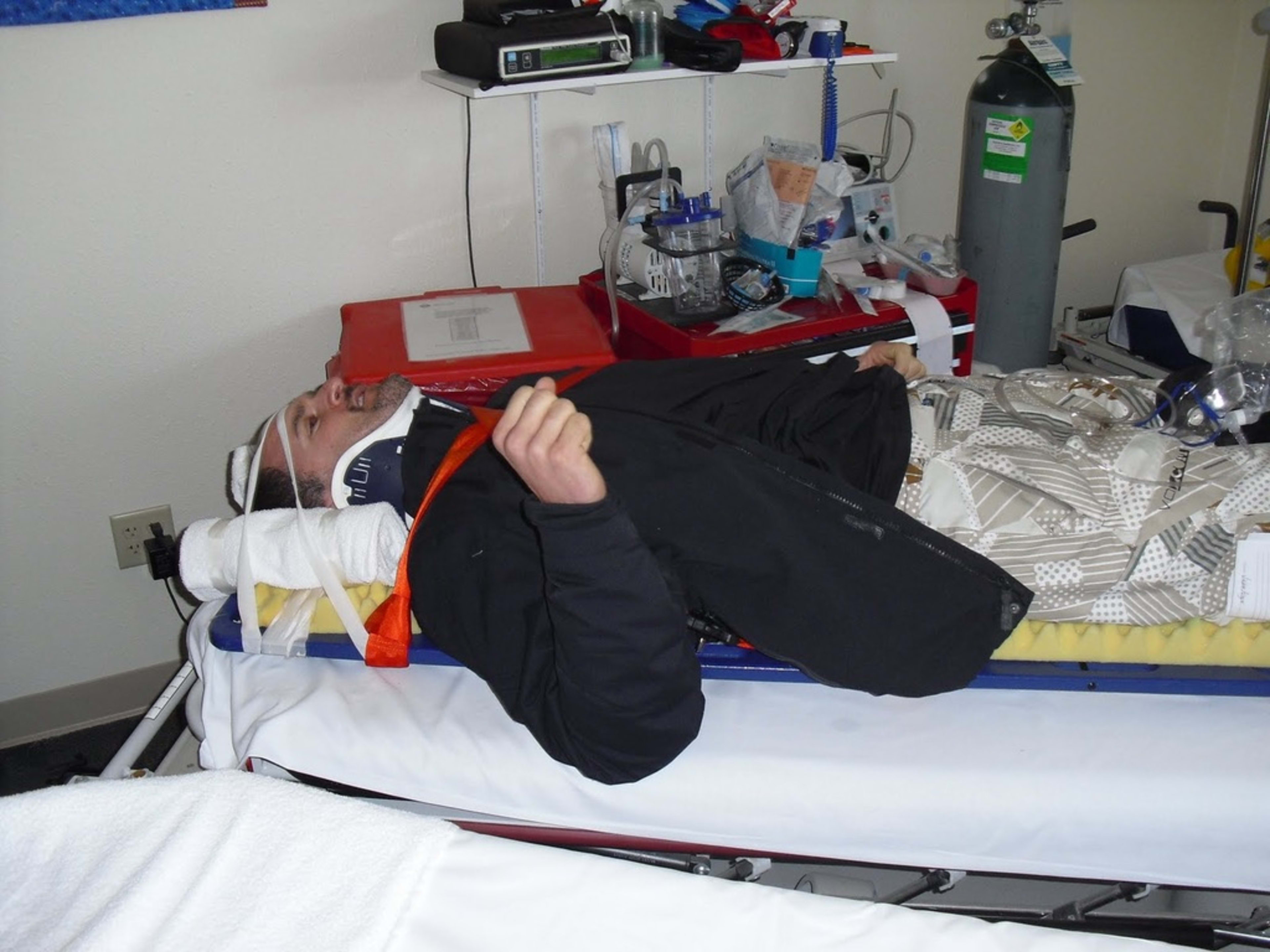 Bill immobilized on a spinal board after the ski accident.
