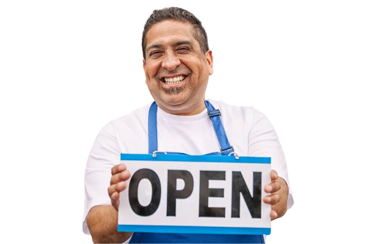 A man in an apron smiles while holding an "OPEN" sign, ready to welcome customers with a warm and inviting CTA.