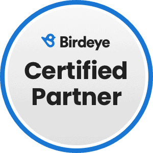 Badge With &Quot;Birdeye Certified Partner&Quot; Text And Blue Bird Logo On A Gray And Blue Circular Background.