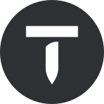 A White Stylized Letter &Quot;T&Quot; Inside A Black Circle, Reminiscent Of Ashley N.p.&Apos;S Unique Design Approach.