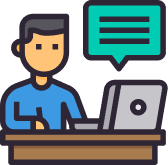 A Man Sitting At A Home Desk With A Laptop And A Speech Bubble.