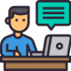 A Man Sitting At A Home Desk With A Laptop And A Speech Bubble.