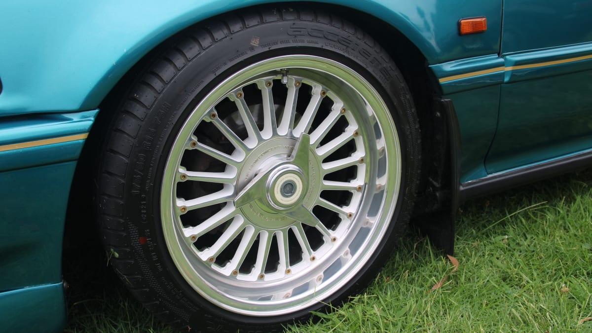 closeup image of a wheel on display at the 11th Annual Japanese Classic Car Show