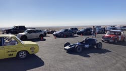 multiple cars lined up, ready to go up the hill climb at Willow Springs in Southern California.