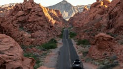 car driving along desert highway in Nevada