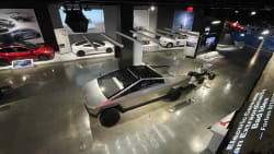 an overhead view of the Tesla exhibit at the Petersen Automotive Museum in Los Angeles