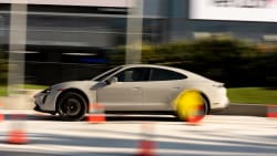 an electric vehicle being test driven at the LA Auto Show in 2022