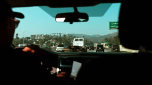 looking out through the windshield of a car on a Los Angeles freeway