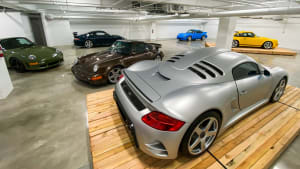 a silver RUF Porsche on the exhibition floor of The Petersen Museum in Los Angeles.