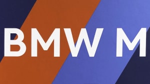 a closeup image of the book cover of "BMW M ..." showcasing the book's title with the M colors in the background.