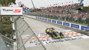race car crossing the finish line at the Long Beach Grand Prix event.