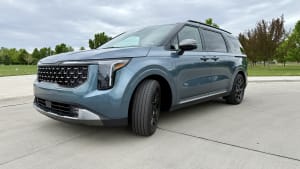 image of the exterior of a blue 2025 Kia Carnival