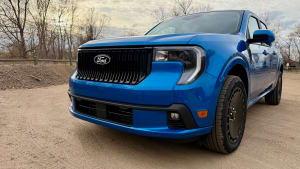 front of a blue Ford Maverick Lobo