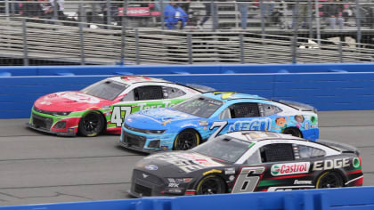 image of three NASCAR vehicles racing on the last cup race held at Auto Club Speedway Fontana