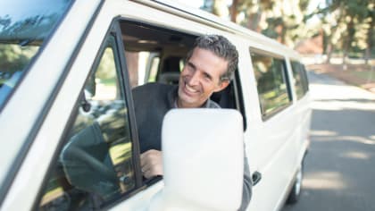 driver of a white van sticking his out the window