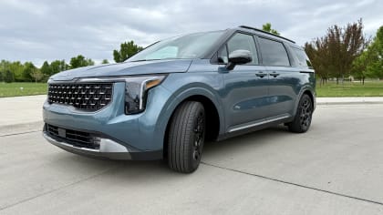image of the exterior of a blue 2025 Kia Carnival