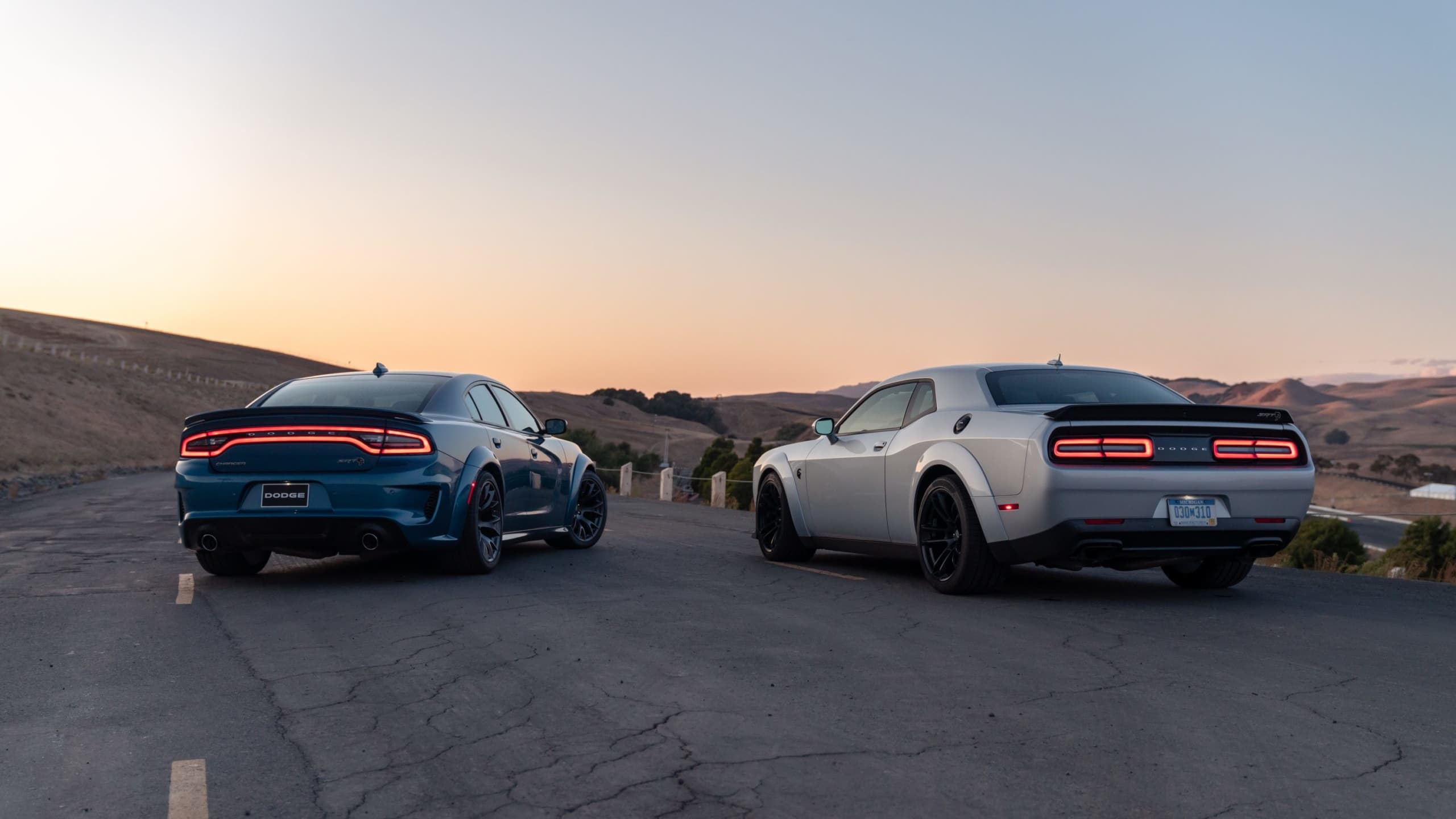 A Dodge Charger and a Dodge Challenger side to side