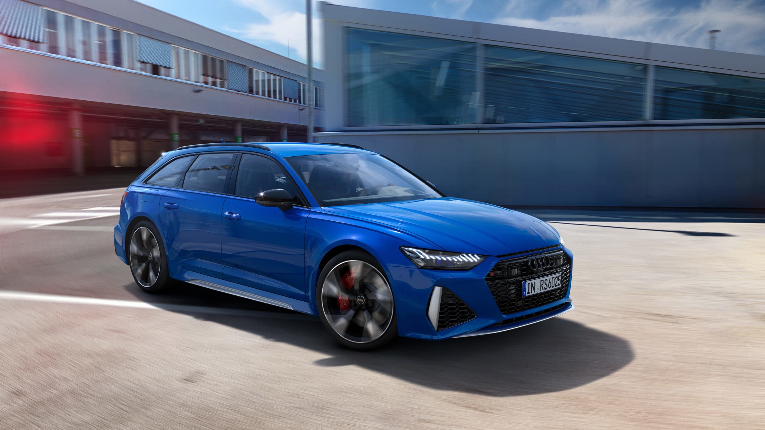 The 2021 Audi RS6 Avant wagon in blue with huge rims.