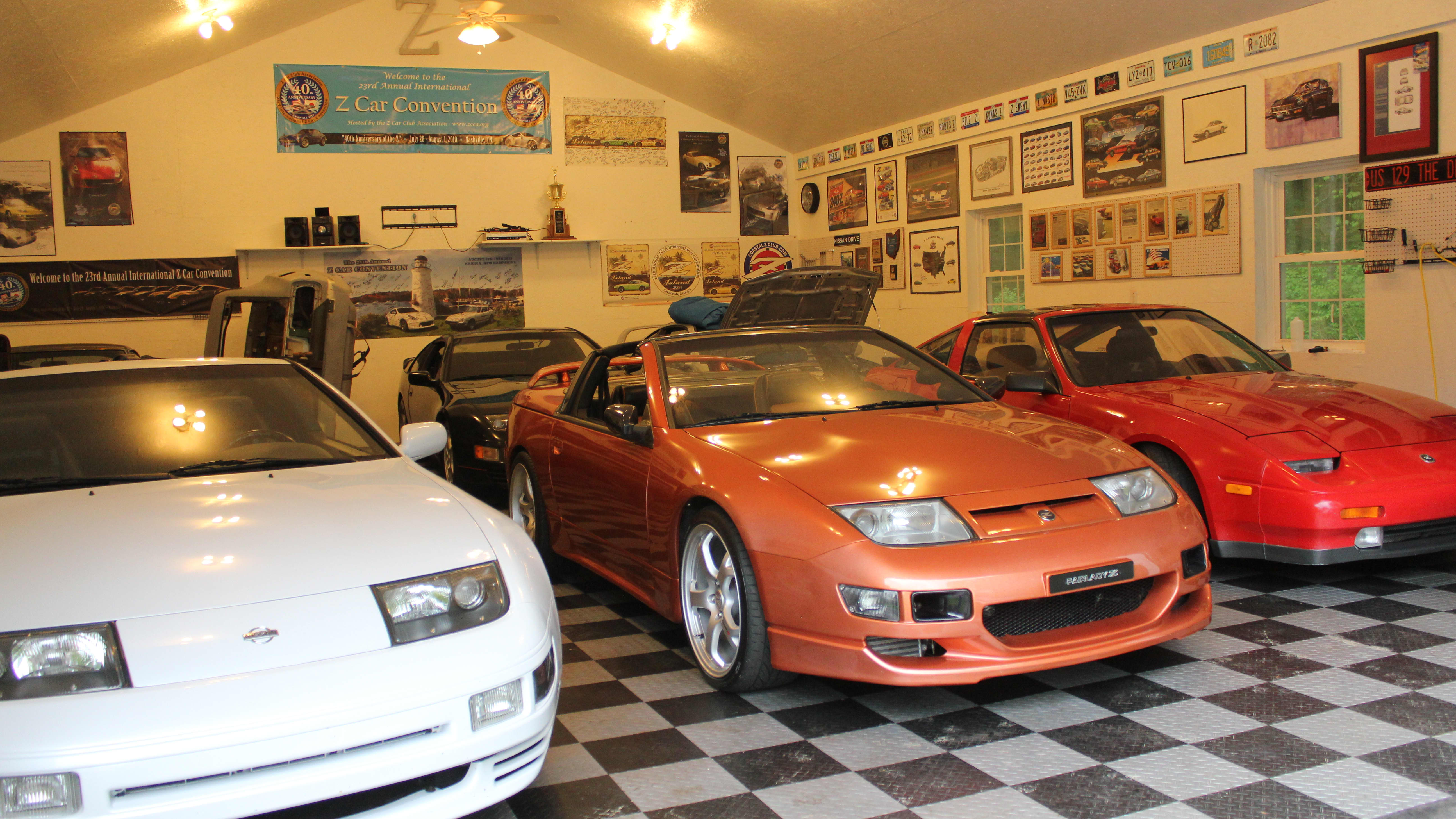 a home garage - albeit very large - full of at least six Z-cars from Nissan/Datsun.