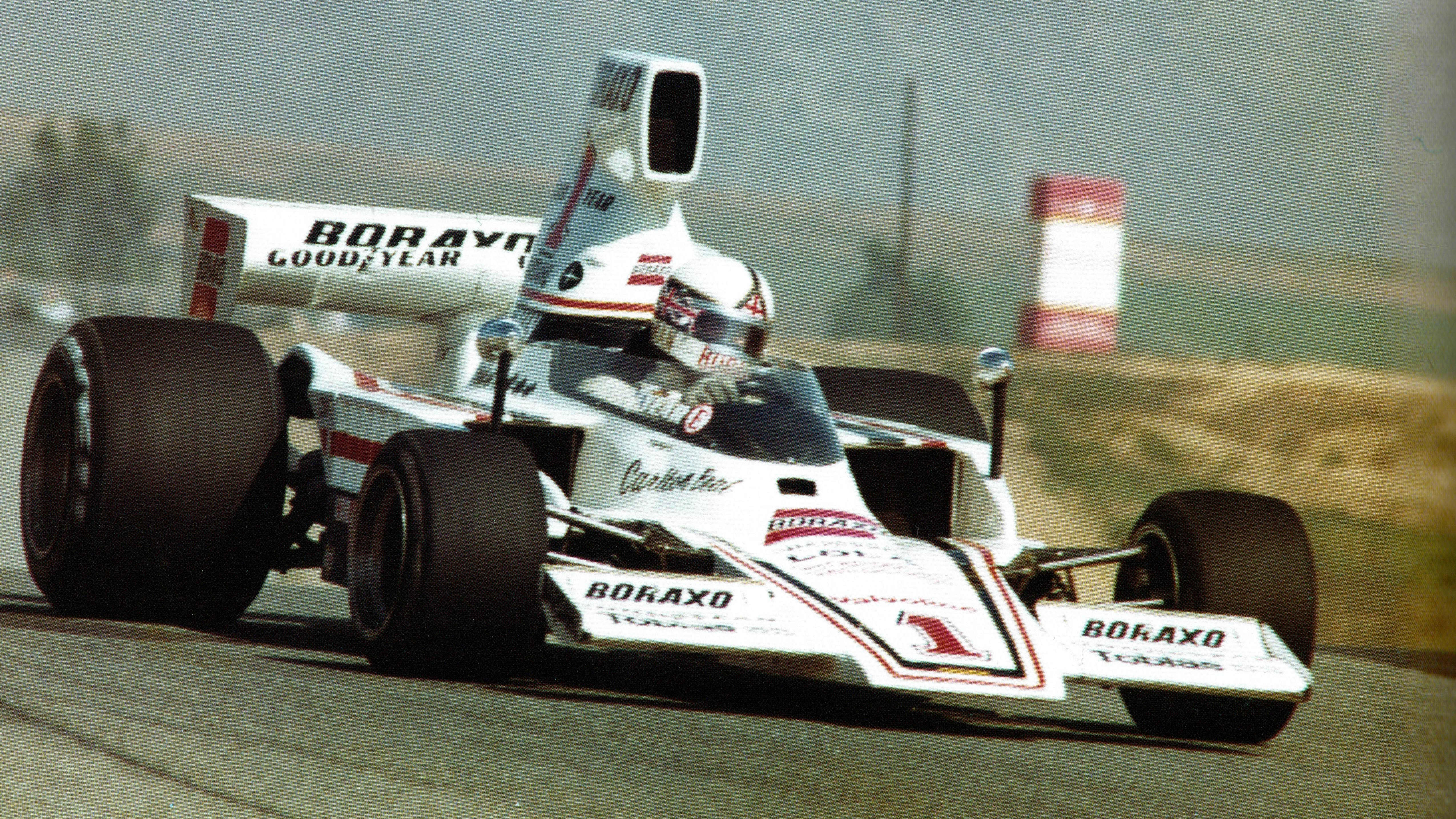 white Formula 5000 race car on the track