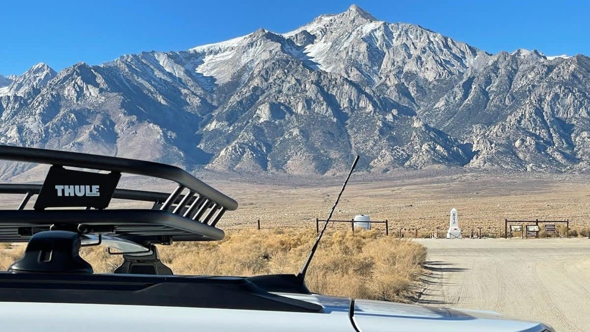 The roof of a Chevrolet Trailblazer with a Thule roof rack, and Mount Whitney in the background.