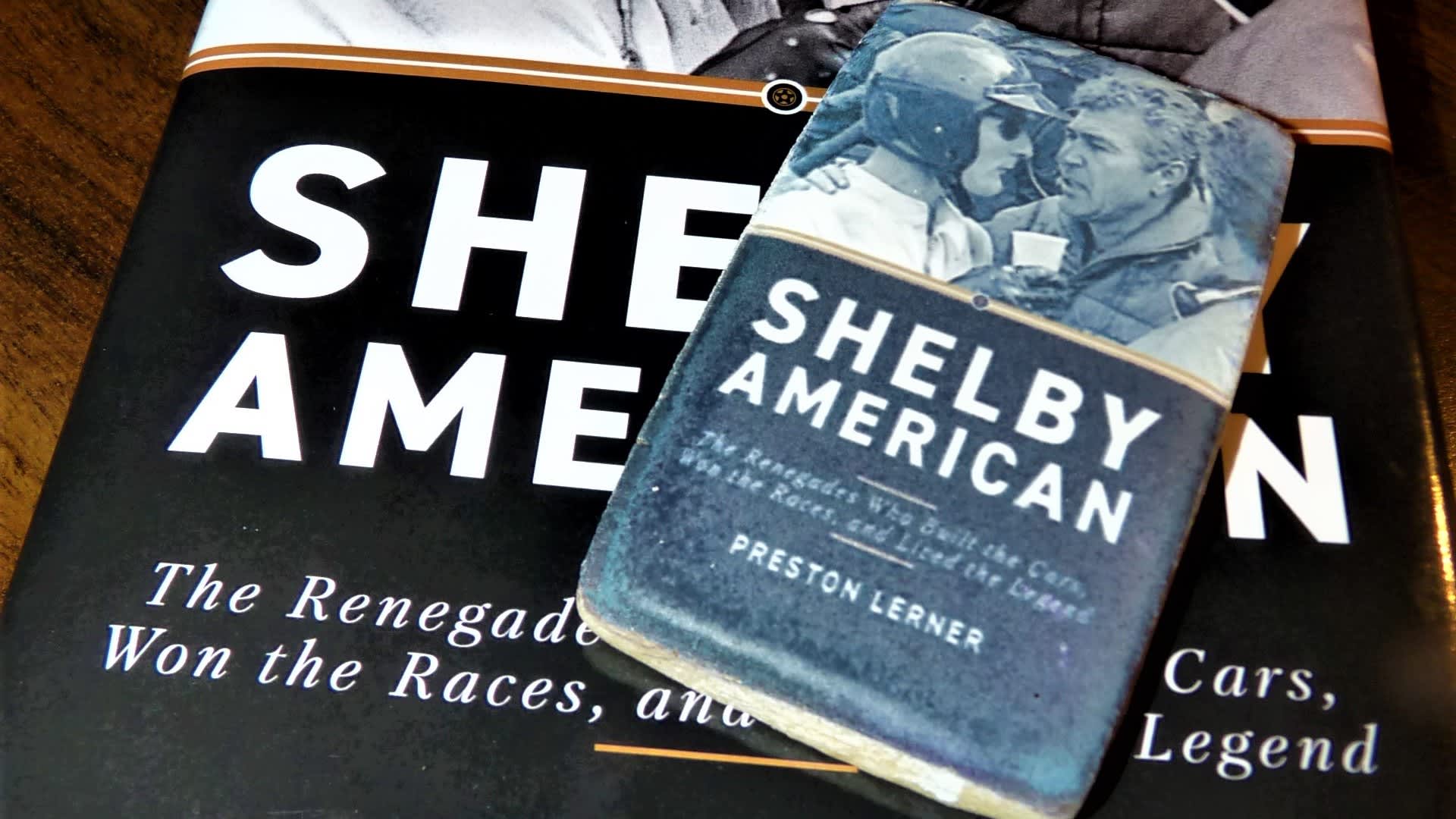 image of a cookie that looks like the book Shelby America, laying on the book itself.