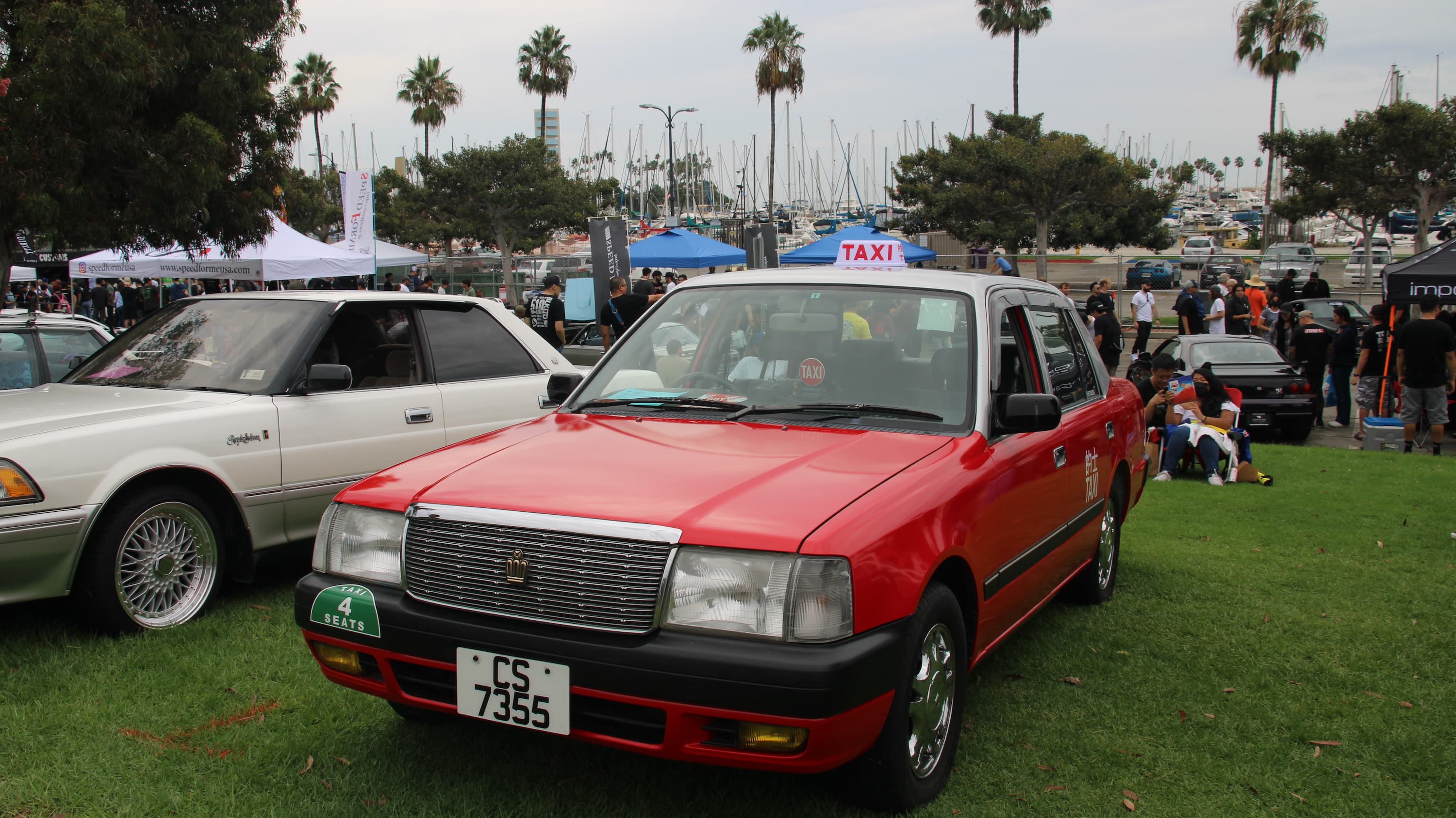 Red and White Toyota Comfort Hong Kong Taxi