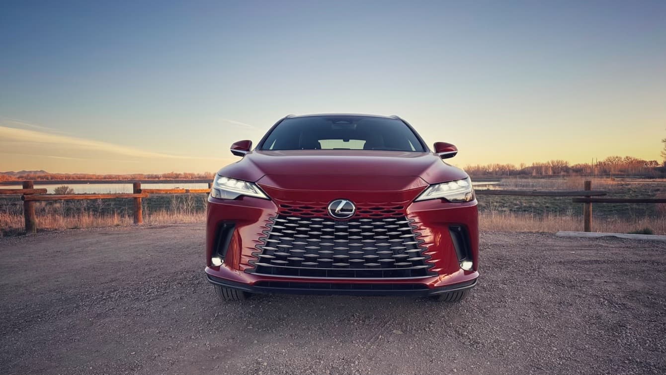 image of the 2023 Lexus RX350h as seen from the front, with a sunrise in the background