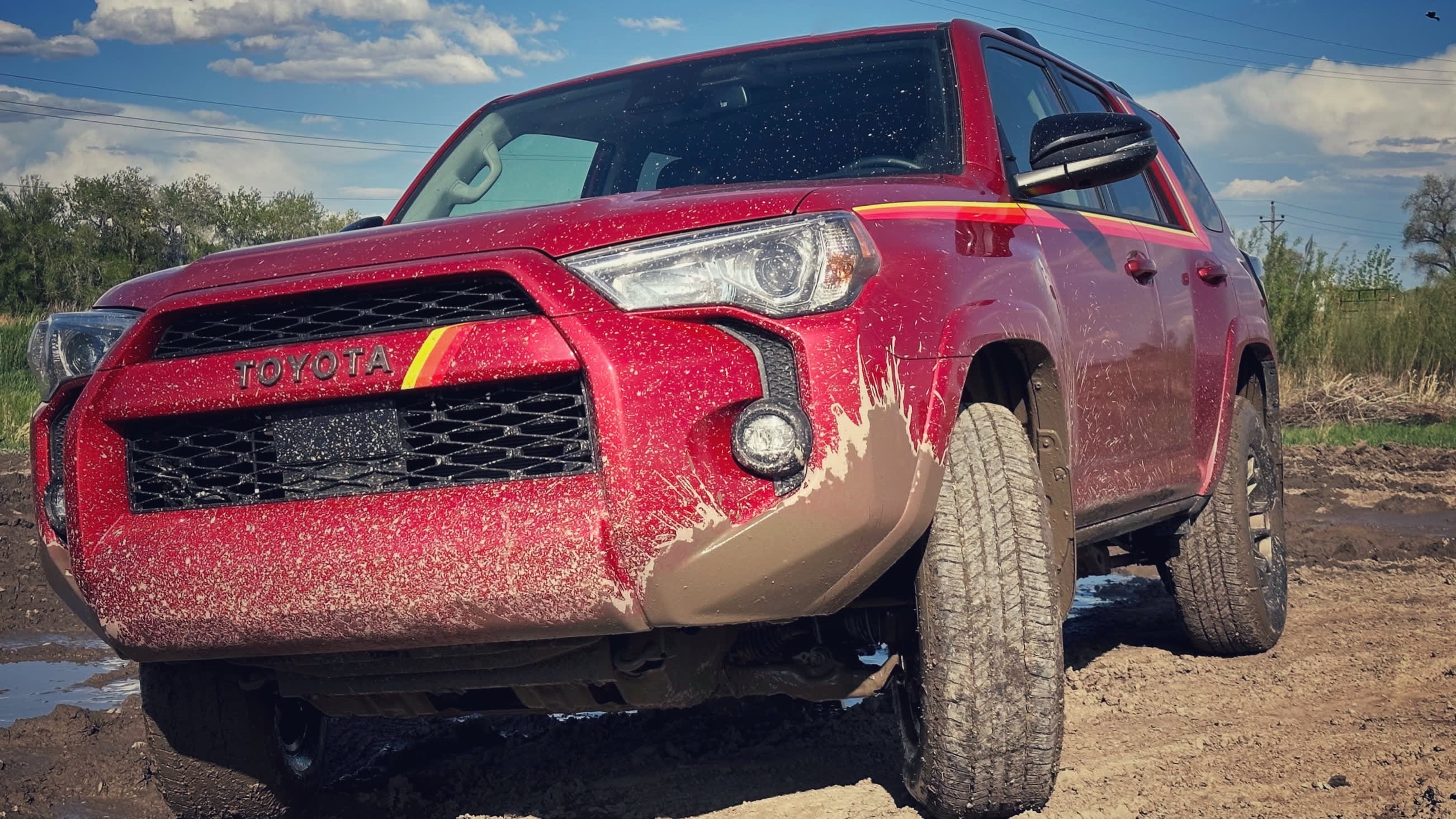 the 40th Anniversary Edition 4Runner seen coming out of a muddy puddle