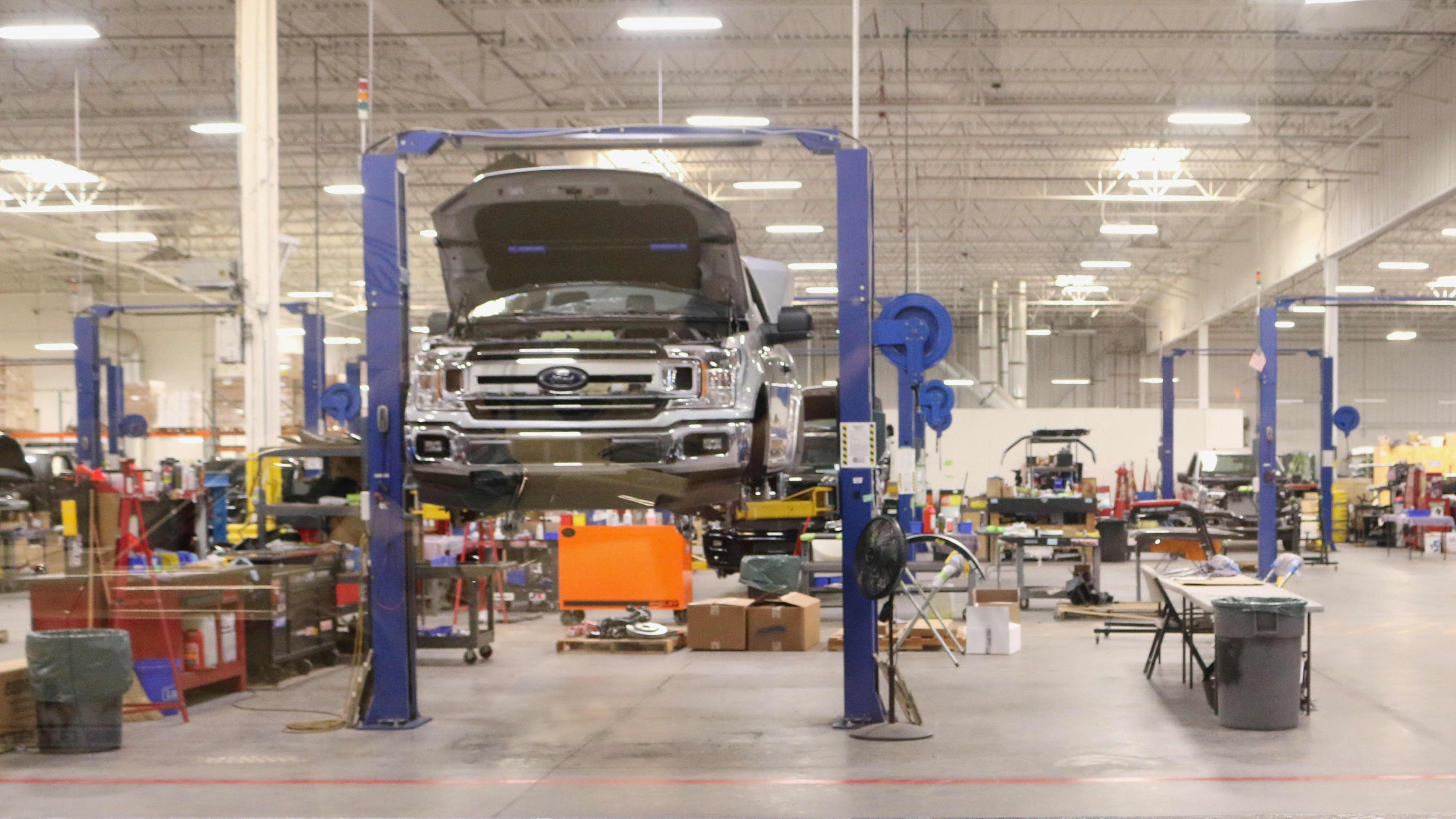 ford truck on the lift in a shop