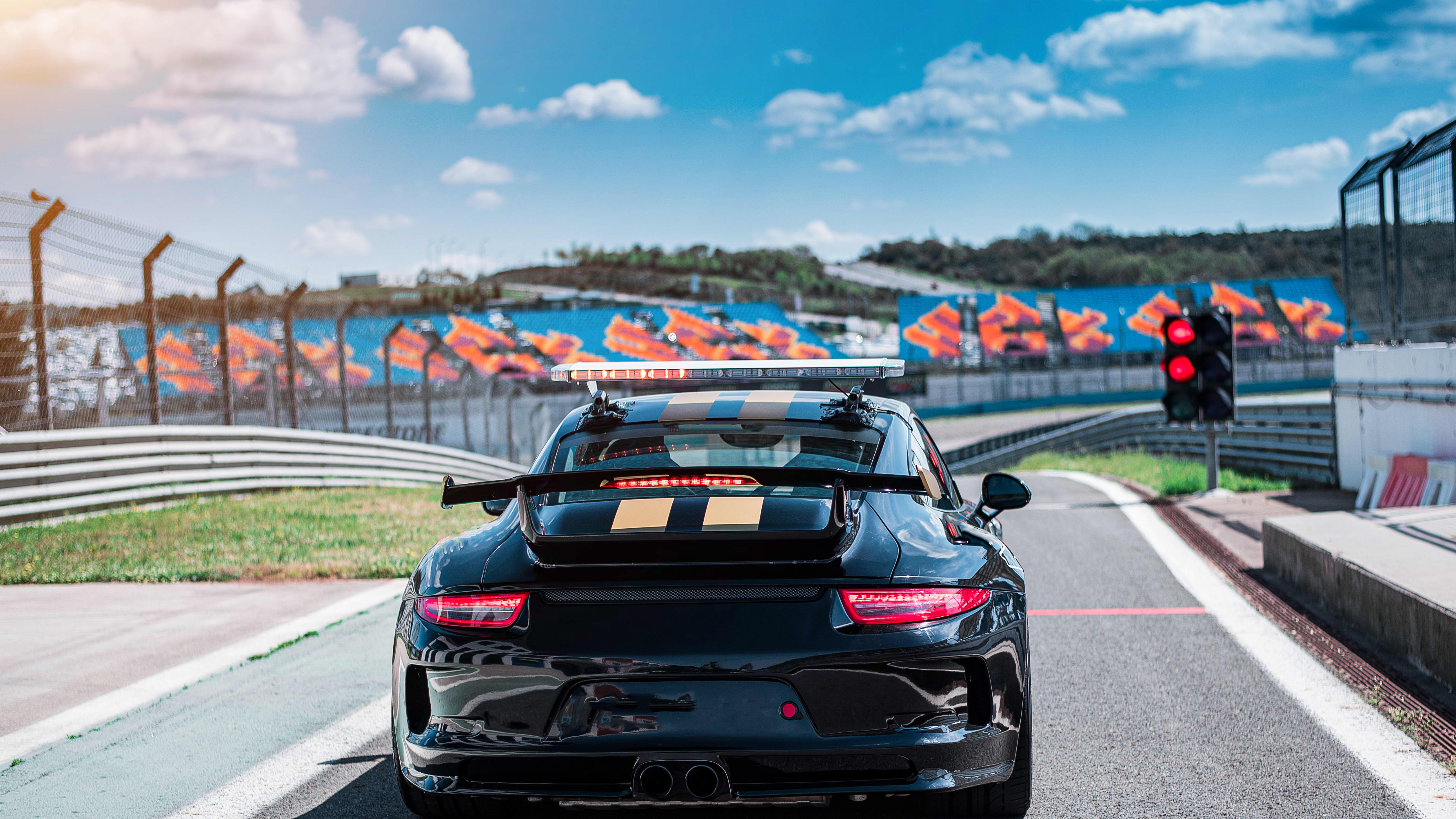 street car on a race track that looks like an F1 track