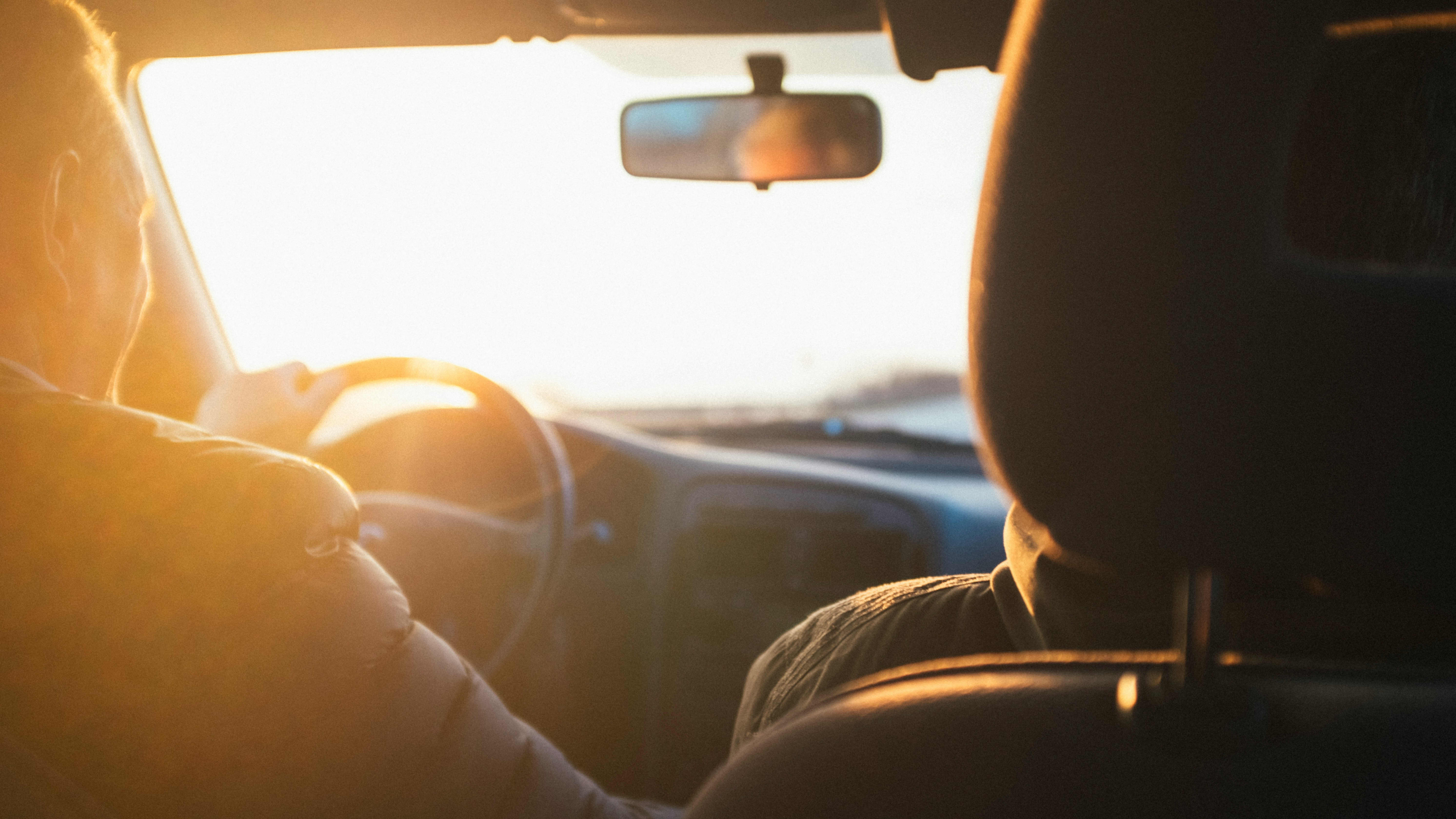 driving a car with the sun outside
