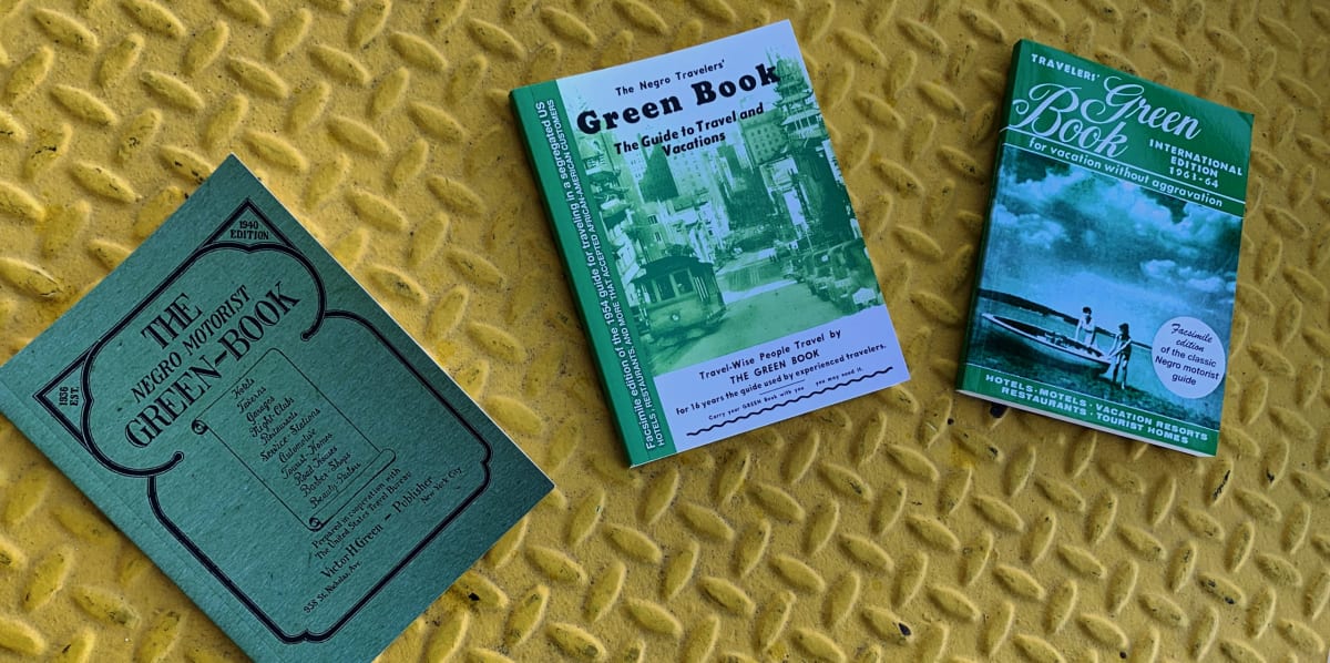 Left-to-right: The 1940, 1956, and 1963-64 facsimile editions of the Green Book (Nakano)