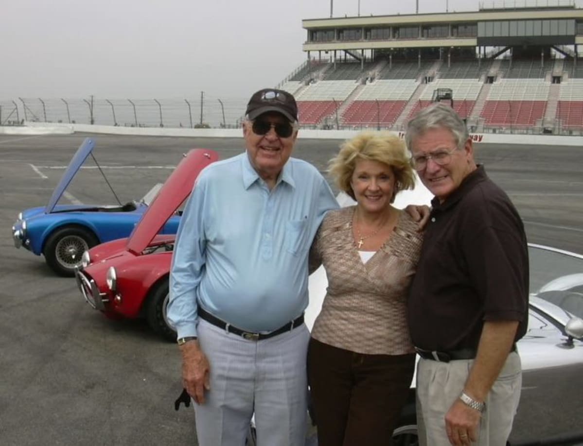  Mister Shelby, Irwindale office manager Marge Peterson, and LACar editor, Stokes … all smiles and vintage Shelby Cobras. 