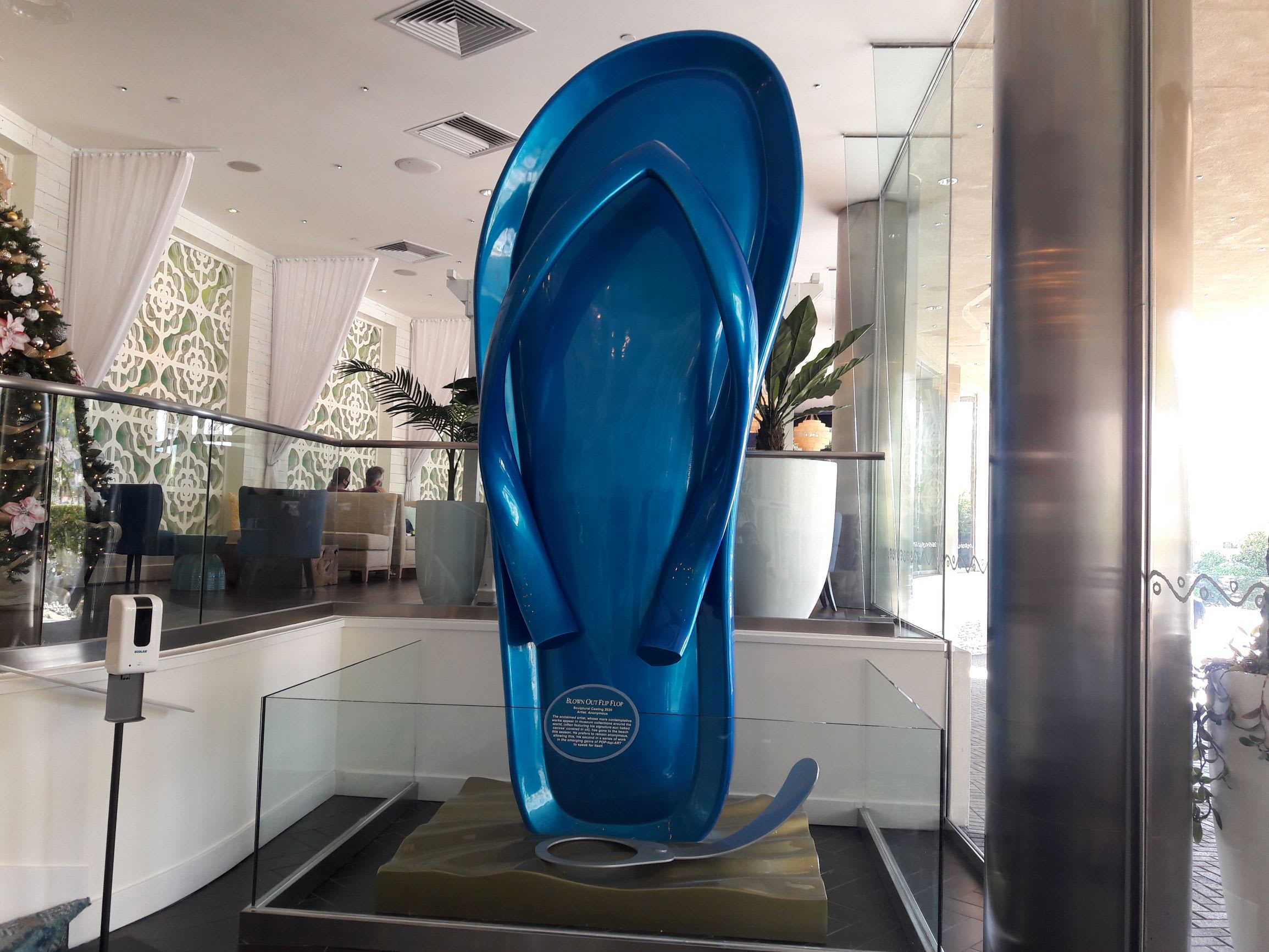You're welcomed to the resort by the giant flip-flop... "I blew out my flip flop…stepped on a pop top."