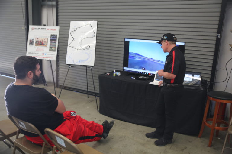 Allen Berg in front of students, teaching racing techniques.