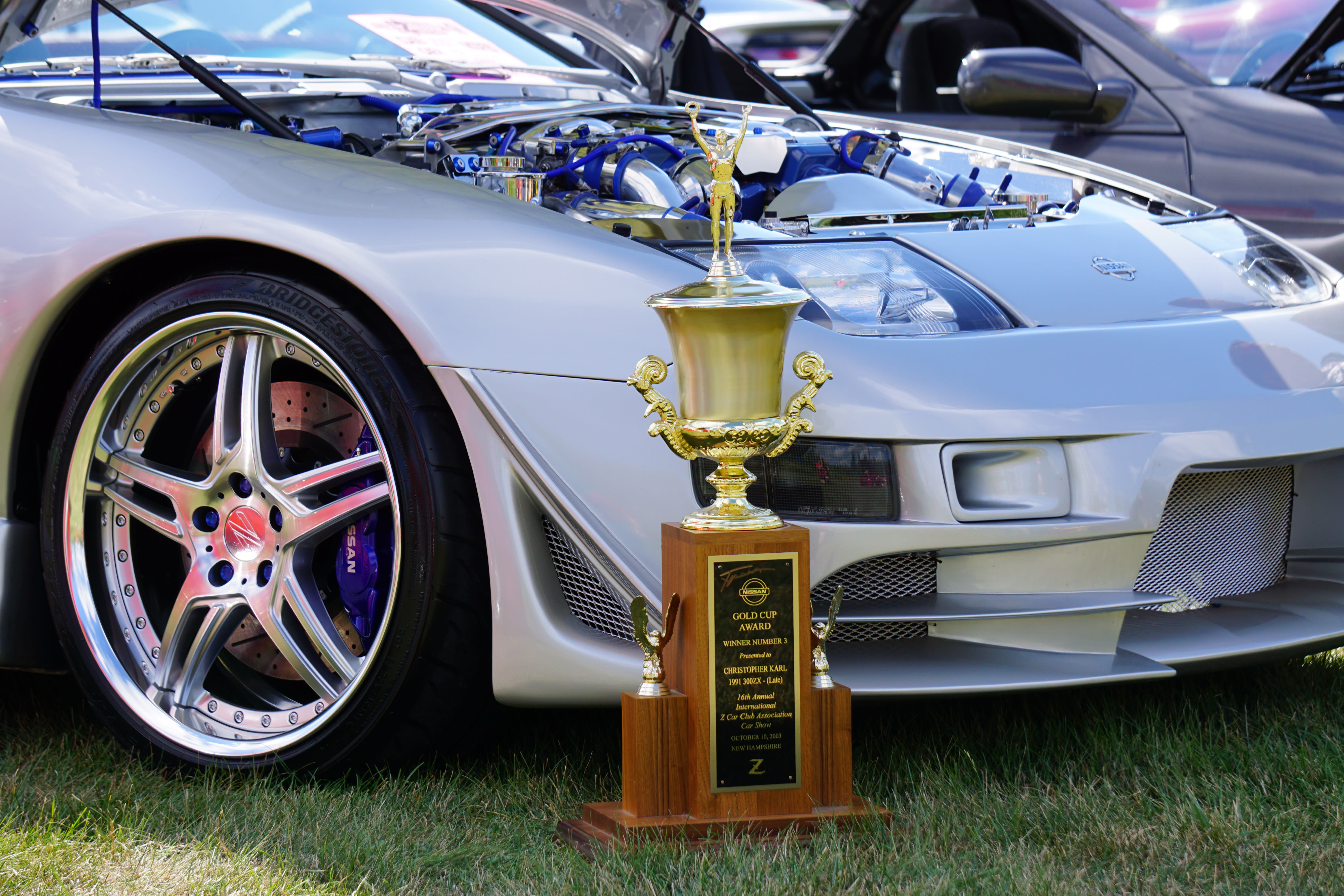 Nissan’s 1990 release of the 300ZX seemed an automotive tour de force not meant to return any profit but rather further cement brand image and market share. In Twin Turbo form, the Z-32 presented the first mass production engine to achieve 100 HP per liter displacement. In the photo, our friend Chris Karl's award- winning 1991 300ZX .