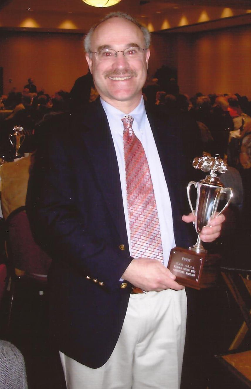 The author, Daniel Banks, holding one of the many awards he won with his Datsuns. A serious historian, this article is a good example of the depth of his work.