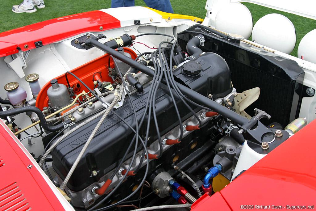 The engine bay. According to Carl Beck, this was the first application of a strut tower brace on a Datsun 240Z, a very common aftermarket part today. In order to keep the brace as rigid as possible the brace was kept straight by cutting through the valve cover. Note the Hitachi-SU carbs instead of the Mikunis that the team used in road racing configuration.