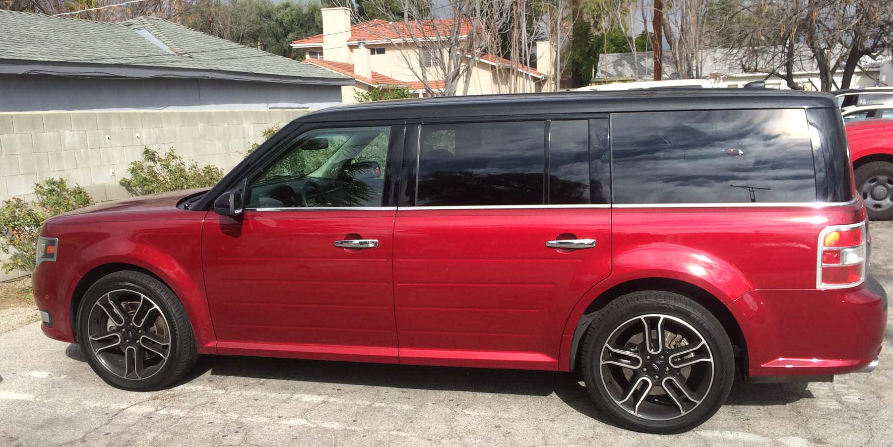 red Ford Flex in Harold's driveway