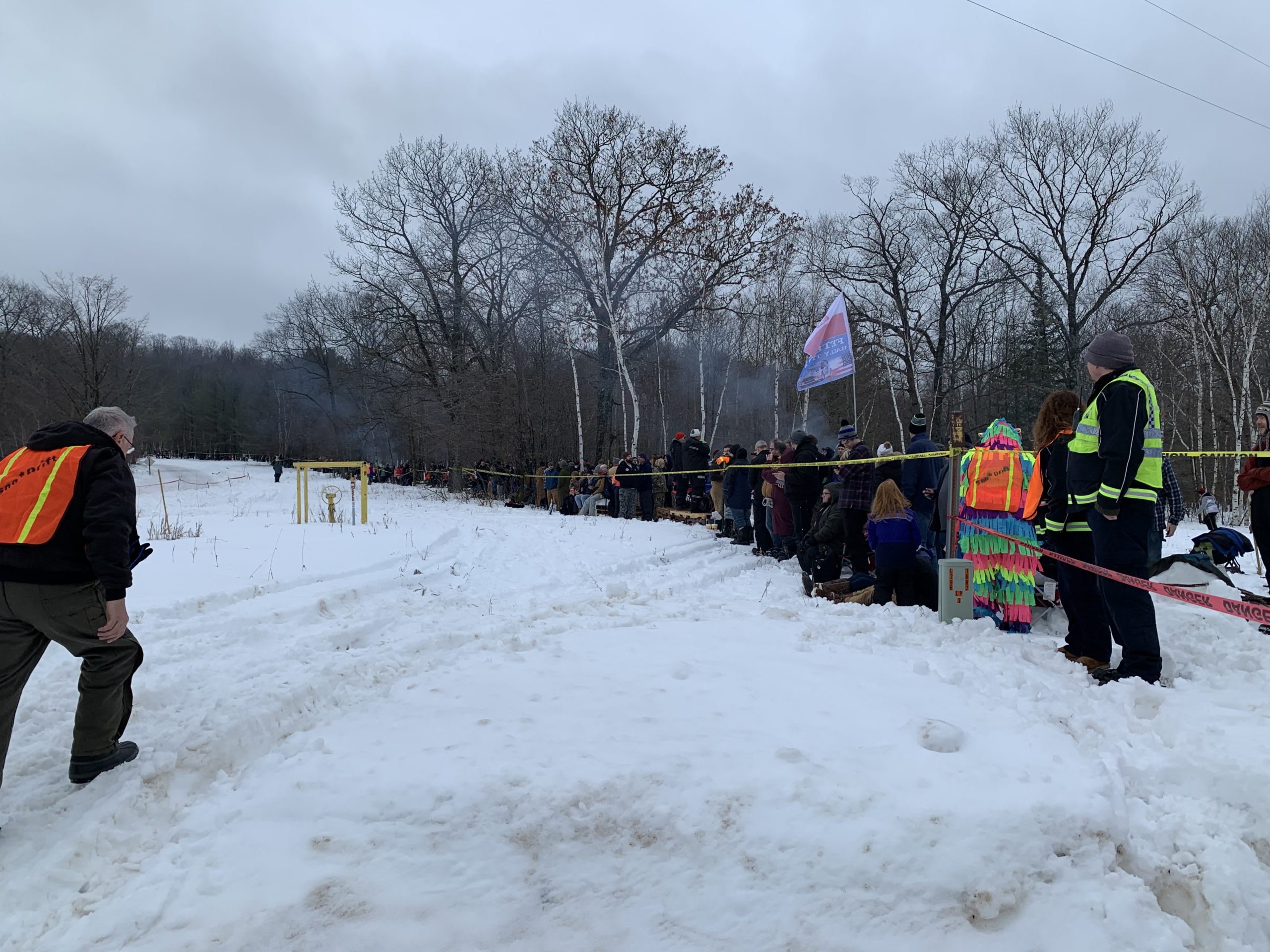 people standing behind the make-shift fences along the route.