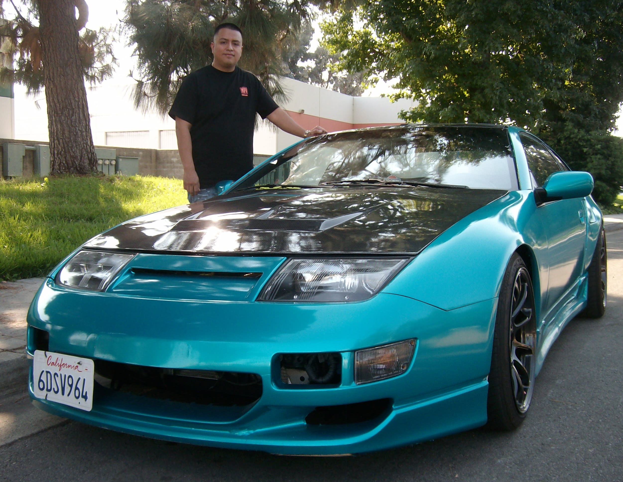 César Diaz from Pomona, CA and his 1991 300ZX. The front bumper comes from a 1999 JDM (Japanese Domestic Model) and TWIN Z provided the over fenders to accommodate the wider wheels and tires.