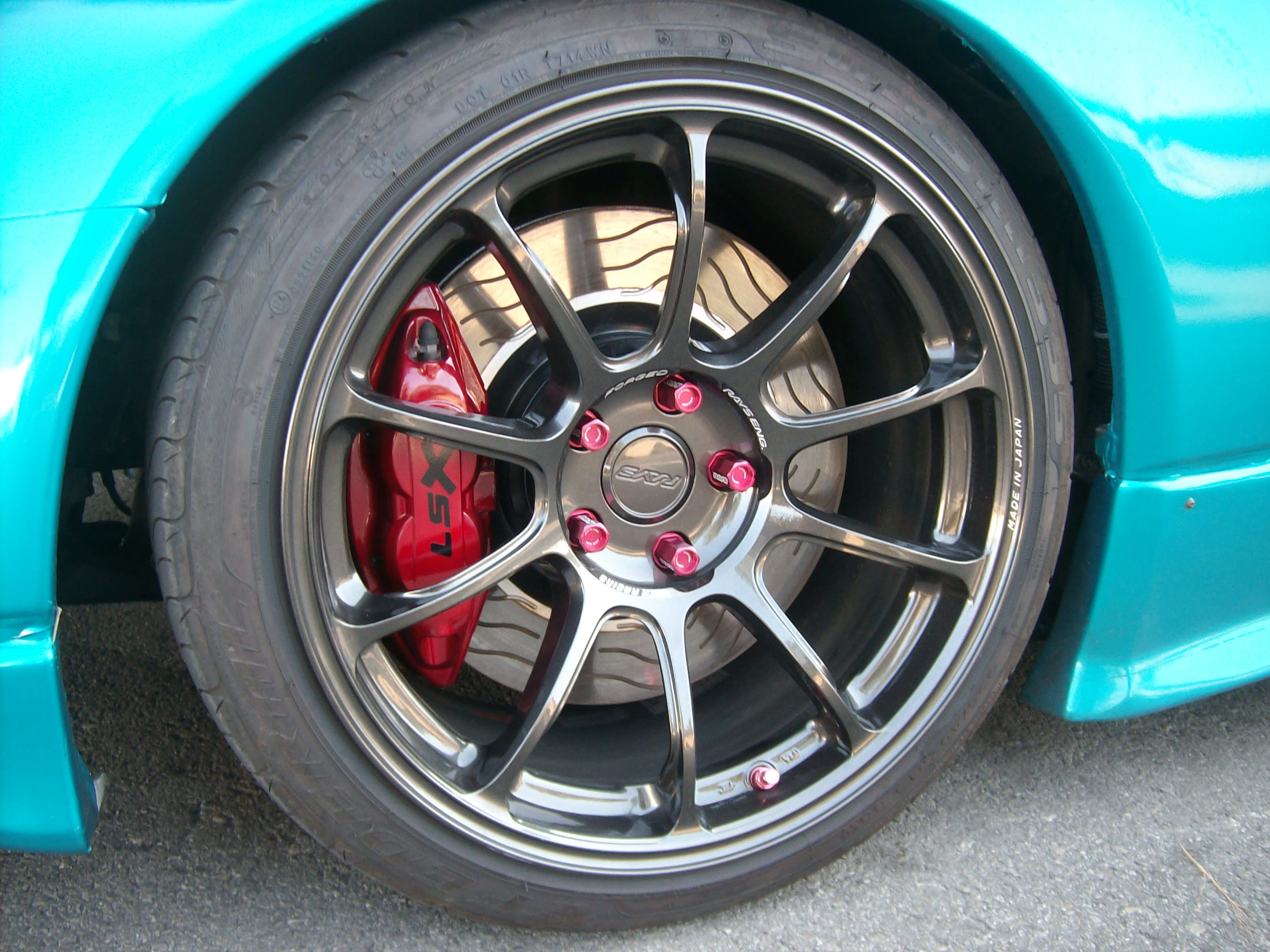 VOLK ZE40s (made by Rays) 18” all around. The front ones are 9.5” wide and the rears are 10.5”. Akebono Big Brake kit from 370Z Nismo fit with a Concept Z adaptor. The 14” rotor (stock is 10.75”) is also from the 370Z. Tires are Federal 595SS.