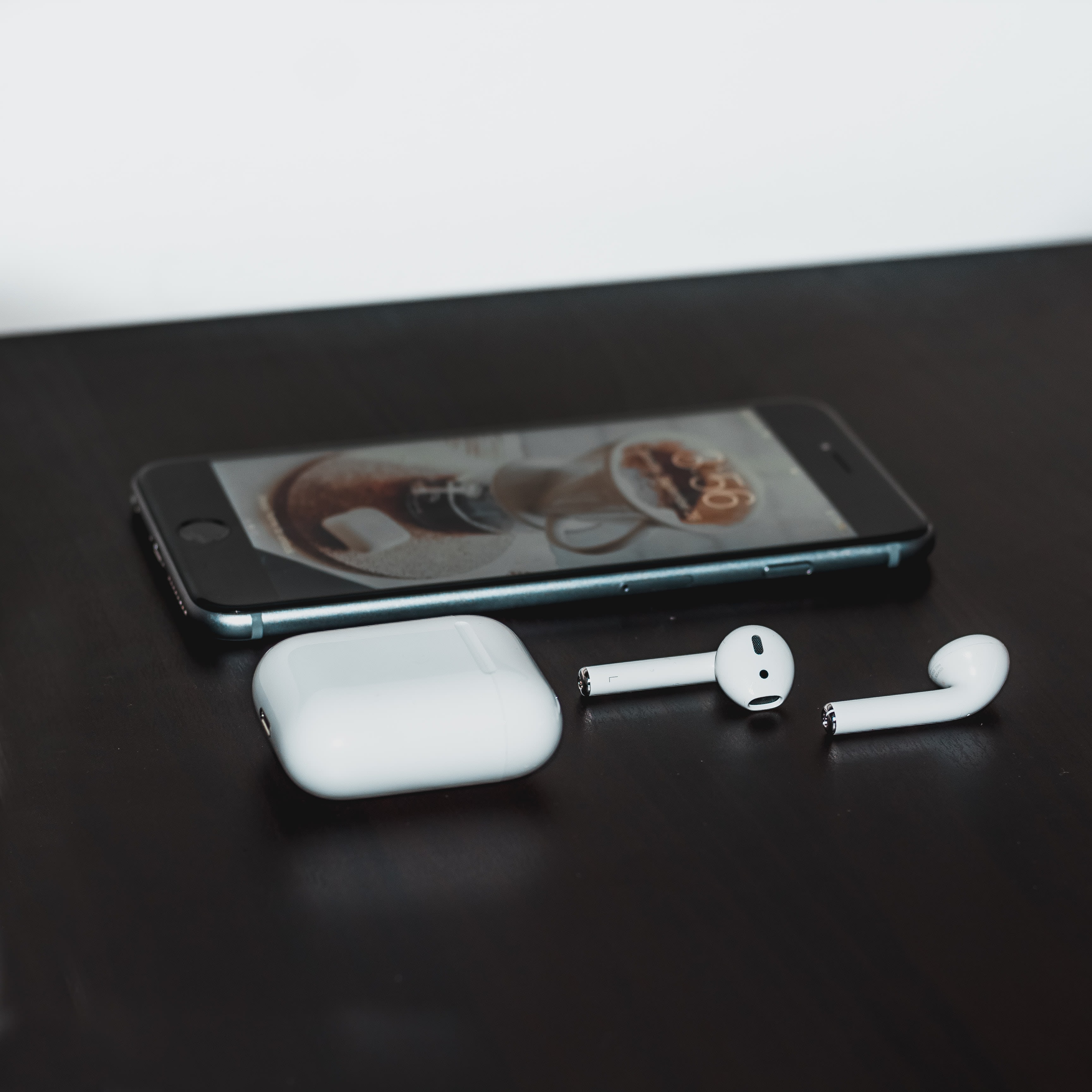 iPhone and AirPods. Photo by Ben Kolde