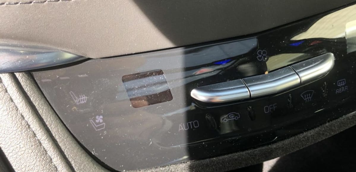 close-up of the plastic-looking cover of the controls in the Cadillac XT5